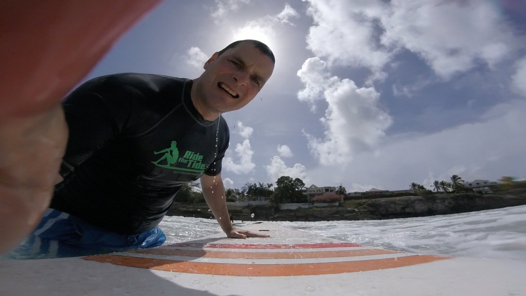 Ride the Tide Instructor adjusting GoPro camera mount 