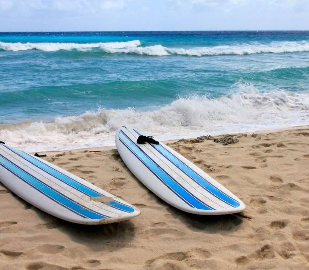 surfboards on a beach in barbados