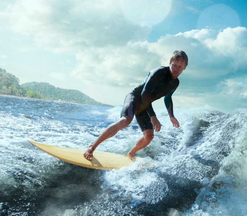 man doing beginner surf lessons in barbados