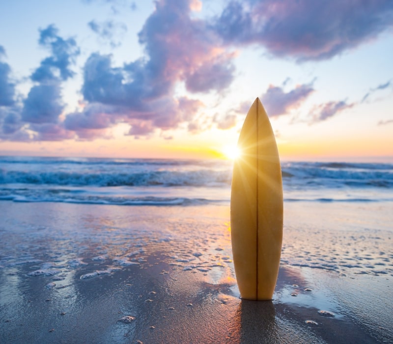 surfboard in front of the ocean